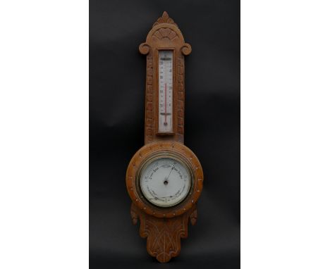 A late Victorian carved light oak banjo barometer thermometer. H.53.5 W.16.5cm 