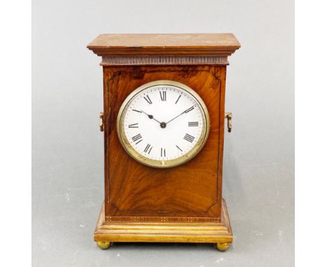 An Edwardian walnut mantel clock.