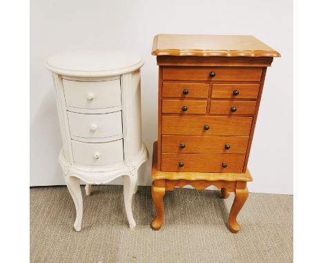 A circular three drawer white painted bedside cabinet, H. 75cm Dia. 36cm together with an eight drawer light oak jewellery ca