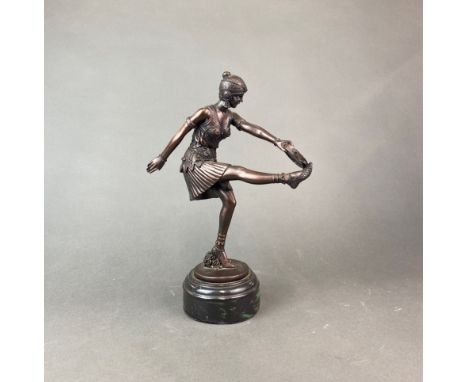 An Art Deco style resin figure of a dancer with a tambourine, H. 32cm.