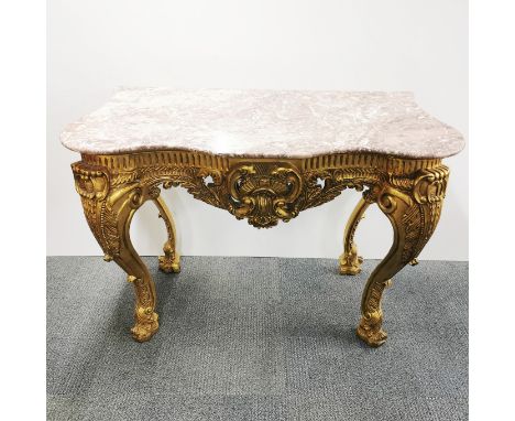 A carved, gilt composition rococo style console table with a serpentine fronted marble top, 128 x 90 x 60cm.