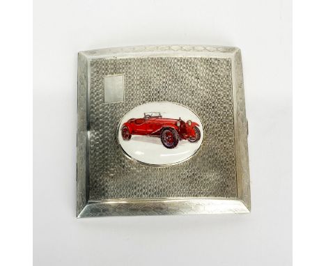 A hallmarked silver cigarette case decorated with a enamelled panel of a vintage racing car, 8 x 8cm.