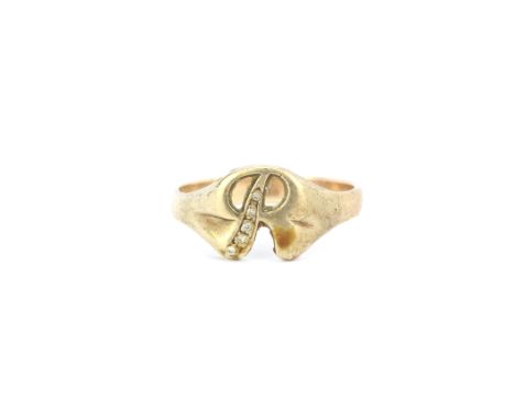 A 9ct yellow gold 'R' shaped diamond set ring, (T).