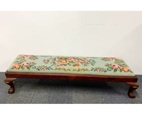 A long tapestry covered walnut veneered footstool, L. 99cm.