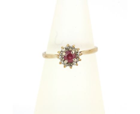 A hallmarked 9ct yellow gold ruby and diamond set ring, (L).