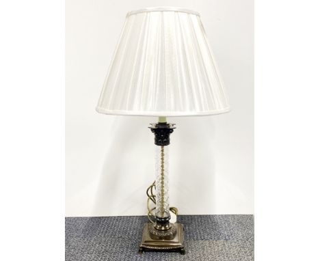 A bronzed metal and cut glass column table lamp with shade, H. 72cm.