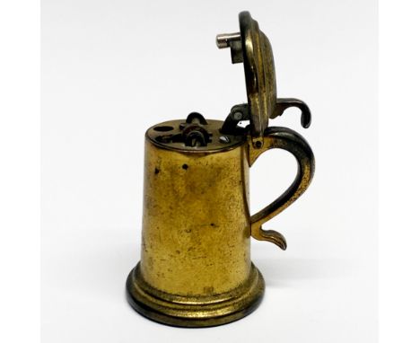 A mid-20th Century Dunhill gilt brass table lighter in the form of a tankard.