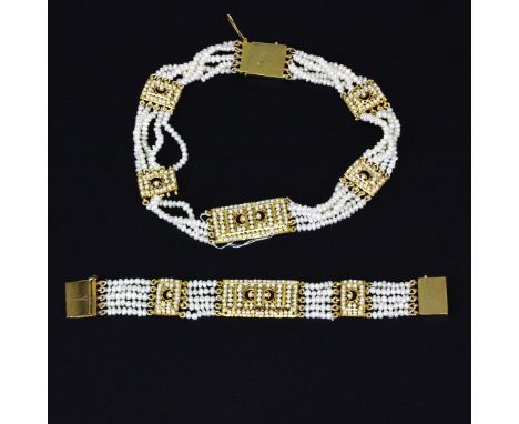 A yellow metal (tested high carat gold, approx. 20ct), enamel and seed pearl necklace, with a matching bracelet, L. 16.5cm.