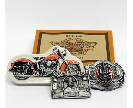 A boxed Harley Davidson watch and two metal belt buckles.