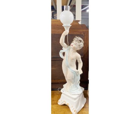 A large ceramic cherub floor lamp, H. 121cm.
