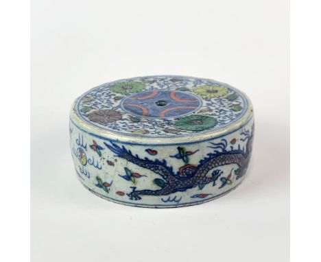 A Chinese hand painted porcelain circular scroll weight or incense holder, Dia. 9cm.