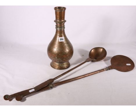 An Islamic ribbed neck copper flask with incised floral decoration, 33 cm and two heavy copper tools, a ladle and a skimming 