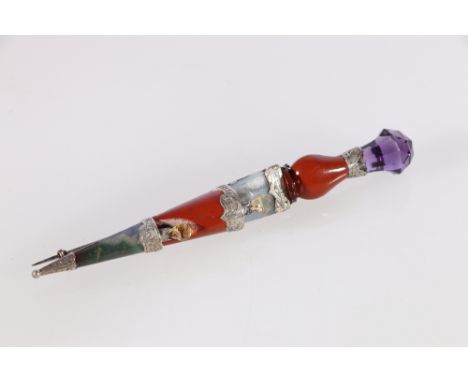 Scottish pebble set kilt pin in the form of a dirk with faceted amethyst finial, 11cm long 