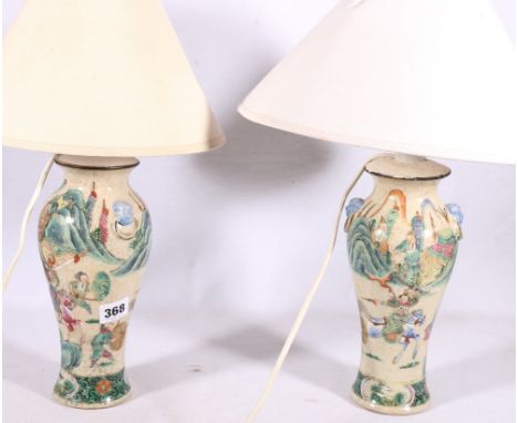 Pair of 19th Century Chinese Canton famille rose baluster vases fitted for electricity decorated with warriors in procession,