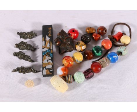 Box containing boxwood netsuke of a dancer, beads, inkstone, etc. A couple of beads have cracks and flaws, please see additio