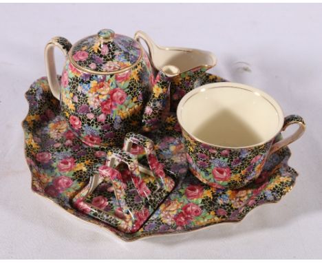 Royal Winton Grimwades Hasel chintz pattern breakfast set on standCONDITION REPORT:Base of the jug is very rough.Toast rack i