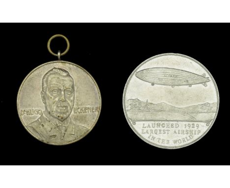 Zeppelin Interest. Two 1930s commemorative medallions relating to the LZ126 & the R.101; the first a silvered medal with top 