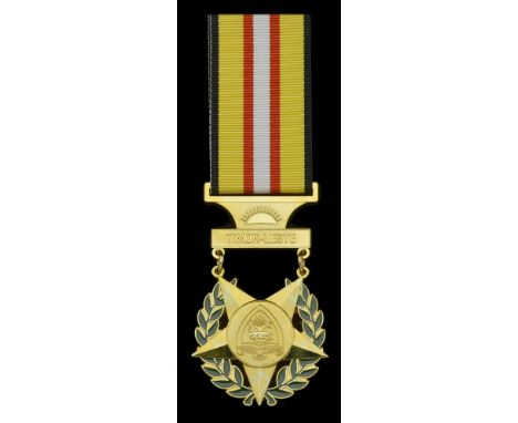 Timor-Leste, Republic, Medal of Merit, breast badge, gilt and enamel, unmarked; together with the related miniature award, ex