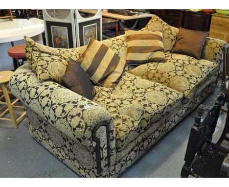 Large modern upholstered, deep two seater sofa with floral and foliate upholstery with scroll arms and cushions.(B.P. 21% + V