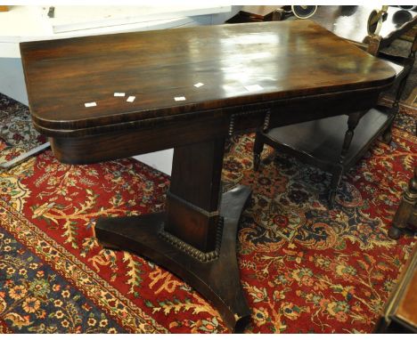 19th century rosewood card table with hinged lid on a triform base.(B.P. 21% + VAT) 