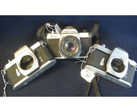 Three Pentax 35mm SLR camera bodies to include; K1000, Spotmatic and Spotmatic F, together with one Pentax 50mm lens. (3)(B.P