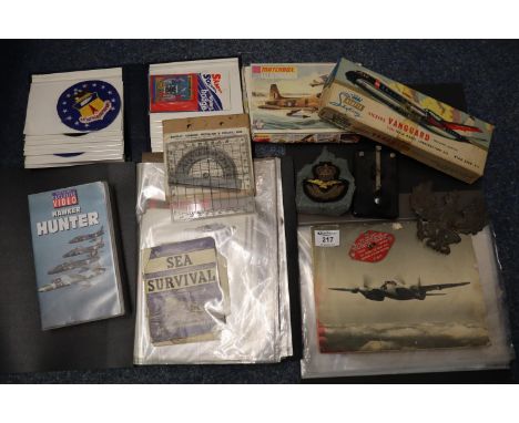 A collection of Naval and civilian blazer badges and other badges, an album of efemera, German eagle helmet plate, Airfix Sky