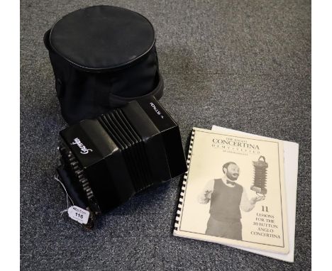 Gremlin ebonised black concertina with metal buttons to each end, in a textile case with playing instruction booklet. (B.P. 2