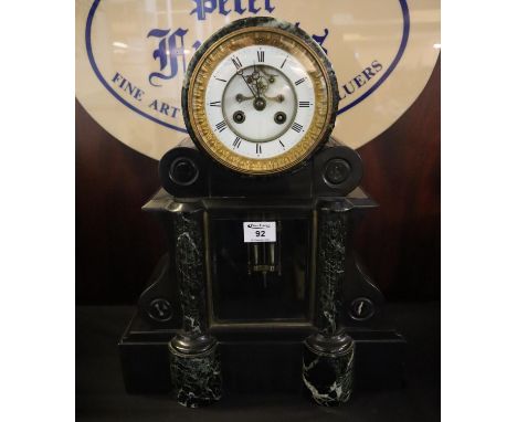 A 19th Century black slate and marble drum head two train mantel clock having Roman enamel face with exposed escapement on sc