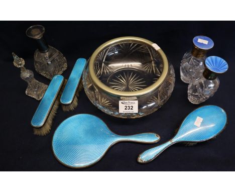 A collection of cut glass items including; fruit bowl, various dressing table jars with silver enamel tops and a group of sil