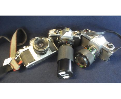 Three Pentax 35mm SLR camera bodies including an ME, together with Pentacon 3.5/30 lens, a Centon 28-70mm zoom lens and a Viv