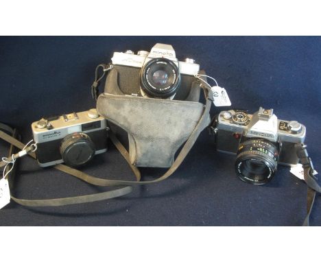 Three Minolta 35mm cameras to include; SRT 100X SLR with 45mm lens, XG-1 SLR with 50mm and a Minolta Hi-matic G compact camer