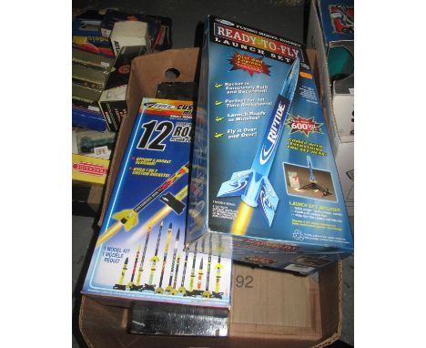 Two Estes model rocket launch sets in original boxes, together with another Estes rocket launcher in wooden stained box. (B.P