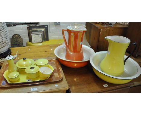Early 20th century lemon ground jug and basin set with matching items, together with an orange lustre Carlton ware jug and ba
