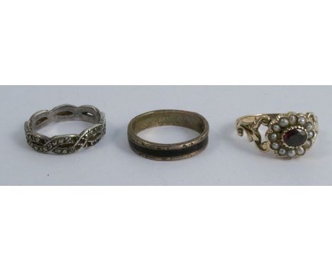 A Victorian garnet and seed pearl ring, in unmarked gold, the cluster to a scroll work shank, finger size R, 2.7g gross, toge