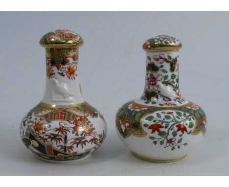 Two 19th century Spode porcelain bottles with stoppers, both embossed with a bird to the neck and decorated in different Imar