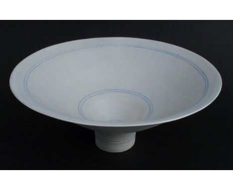 Lucie Rie, a white porcelain footed bowl, decorated with blue lines, impressed mark, height approximately 4ins, diameter appr