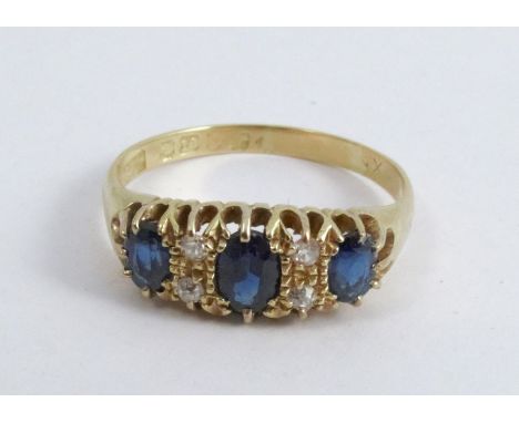 A diamond and sapphire ring, Chester 1918, the three graduated oval cuts with pairs of old single cuts between, finger size T