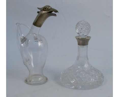 A novelty silver mounted and glass decanter, modelled as a bird, with the hinged lid being the head, one glass wing af, Birmi