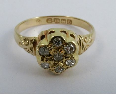 A seven stone diamond 18 carat gold ring, set with old single cuts, finger size Q 1/2, 3.3g gross