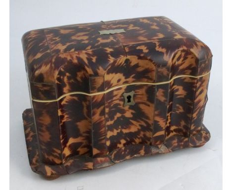 A Victorian tortoiseshell tea caddy, with serpentine front, the interior fitted with two covered compartments, height 5.25ins