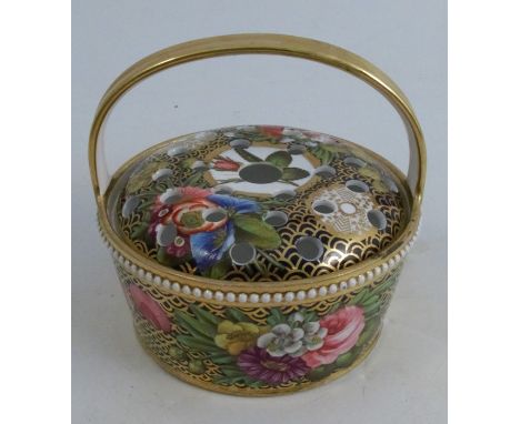 A 19th century Spode porcelain pot pourri basket, of circular form with gilt handle over, the pierced cover and basket decora