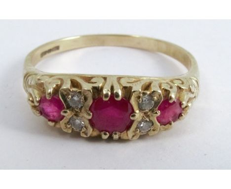 A 9 carat gold diamond and ruby ring, in the antique style, finger size T 1/2, 2.6g gross