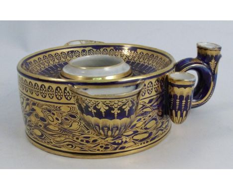 A late 18th century Worcester inkwell, of circular form with central inkwell, two spouts and three pen holders, one in the ri