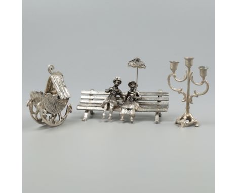 No reserve - 3-part lot miniatures silver. Consisting of a rocking cradle, 3-light candlestick and a couple with a hand paras