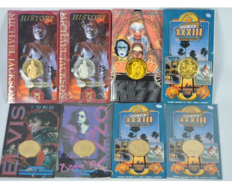 Eight collectible coins / medallions struck by Liberty mint in the USA. Three coins have images of SUERBOWL XXXIII, Michael J