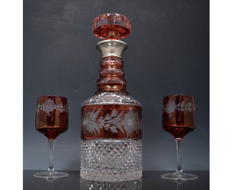 Cut glass and ruby overlaid mallet shape decanter, triple ring neck, 29cm and six wine glasses with ruby overlaid bowls (7).