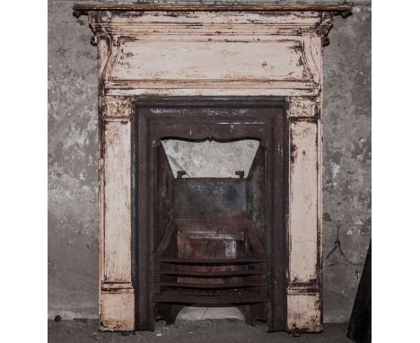 Victorian cast iron mantelpiece and fire inset, with serpentine basket, height approximately 110cm, width 90cm.