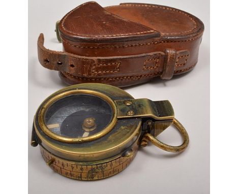 Brass marching compass, Anglo Swiss Association, No. 38930, 1915, mother of pearl scale in a leather case.