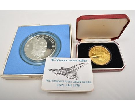 Silver gilt Concorde Medallion, First Passenger Flight 1976, with certificate, boxed and Republic of Panama twenty Balboas co