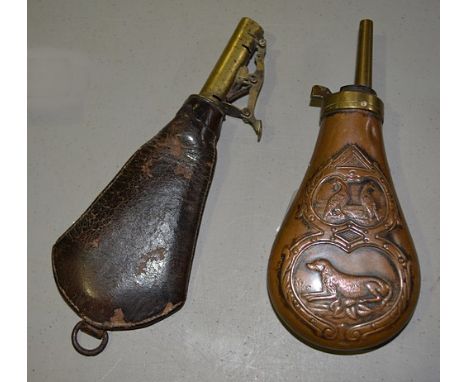 Metal shot flask, embossed with a dog and game birds, length 18cm and a leather flask, brass mounted (2).